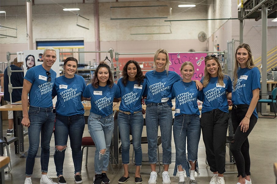 group of people wearing getting involved makes a difference t-shirts